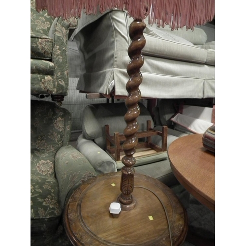 487 - CARVED OAK BARLEY TWIST STANDARD LAMP/TABLE - WARRANTED UNTIL 12 NOON ON TUESDAY FOLLOWING THE ABOVE... 