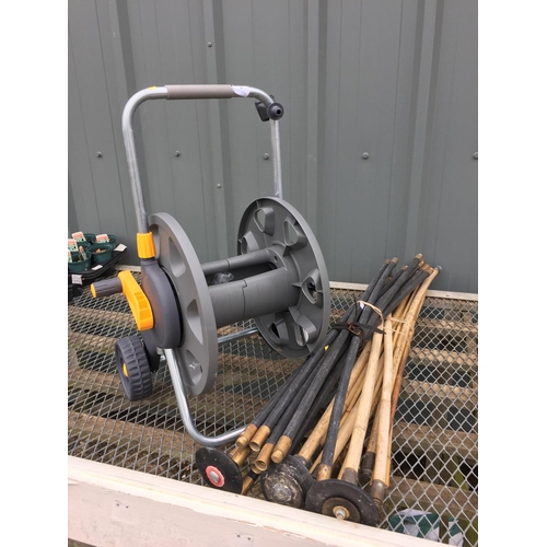 4 - HOZELOCK HOSE REEL ON WHEELS & DRAIN RODS ETC.