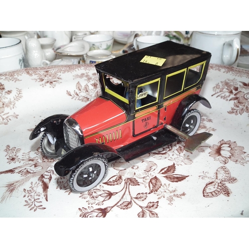 398 - 3 MODERN TINPLATE CLOCKWORK VEHICLES