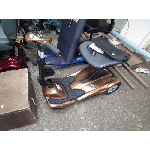 80 - DRIVE DEVILBLISS FOLDING SCOOTER GOLD WITH CASE - CHARGER WARRANTED UNTILNOON TUES FOLLOWING THE ABO... 