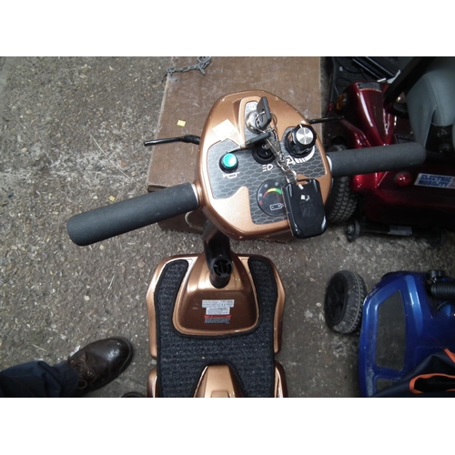 80 - DRIVE DEVILBLISS FOLDING SCOOTER GOLD WITH CASE - CHARGER WARRANTED UNTILNOON TUES FOLLOWING THE ABO... 