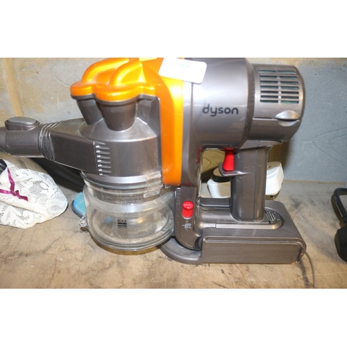 89 - DYSON HAND HELD VACCUM - WARRANTED UNTIL NOON TUES FOLLOWING THE ABOVE SALE