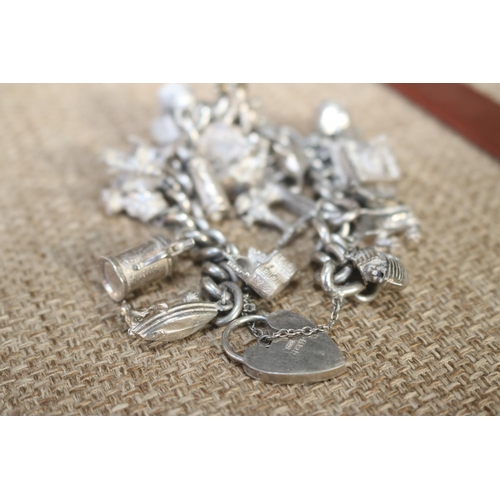 409 - SILVER HALL MARKED CHARM BRACELET - 21 CHARMS WITH SPECIALS - OPENING WEDDING CAKE/TANKARD/ARK/VICTO... 