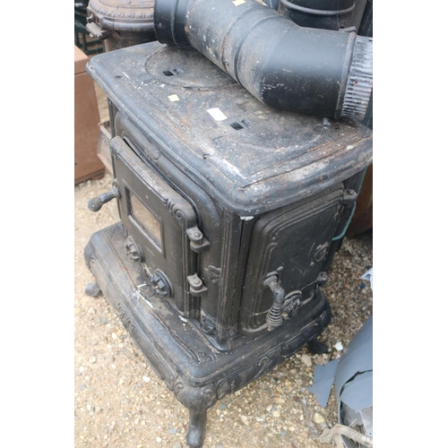 100 - FRENCH CAST IRON STOVE WITH STANDING PIPES