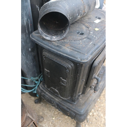 100 - FRENCH CAST IRON STOVE WITH STANDING PIPES