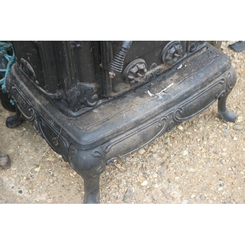 100 - FRENCH CAST IRON STOVE WITH STANDING PIPES