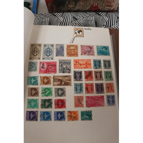 583 - INTERNATIONAL STAMP ALBUM & BOX OF STAMPS