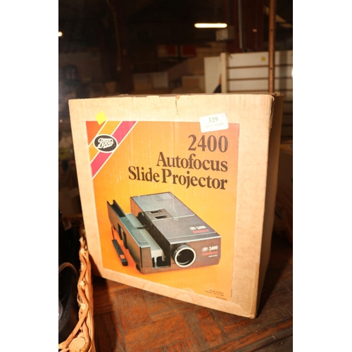 329 - SLIDE PROJECTOR - WARRANTED UNTIL NOON TUES FOLLOWING THE ABOVE SALE