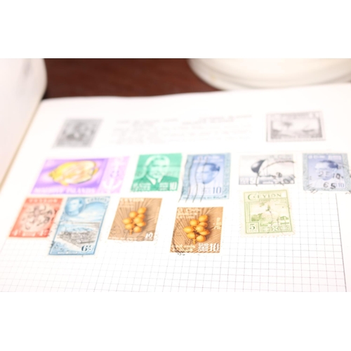 410 - THE UNIVERSAL STAMP ALBUM WITH STAMPS