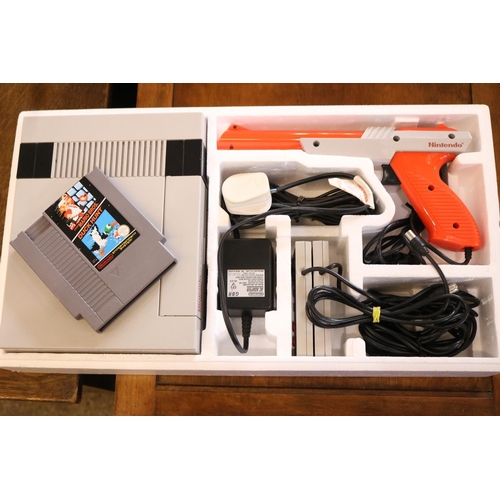 487 - NINTENDO ENTERTAINMENT SYSTEM, WITH GAME ORGANISER & 28 GAMES - WARANTED UNTIL 12 NOON FOLLOWING THE... 