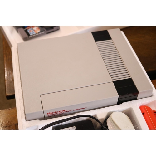 487 - NINTENDO ENTERTAINMENT SYSTEM, WITH GAME ORGANISER & 28 GAMES - WARANTED UNTIL 12 NOON FOLLOWING THE... 