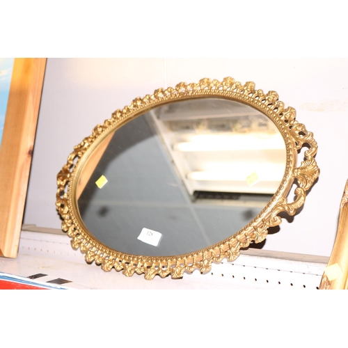 128 - SMALL OVALMETAL GILT FRAMED MIRROR