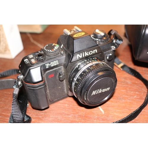 359 - NIKON F-301 CAMERA WITH BAG AND INSTRUCTIONS