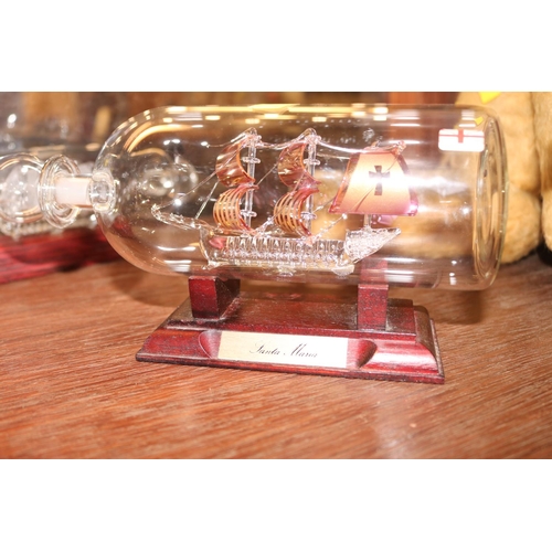 411 - 2 GLASS SHIPS IN BOTTLES, LANCASTER IN GLASS DOME, PAPERWEIGHTS, ETC