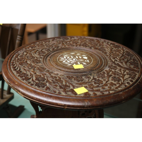 369 - SMALL ORNATELY CARVED TABLE WITH INLAID SHELKF