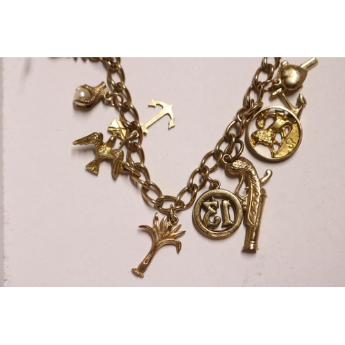 405 - 9CT GOLD CHARM BRACELET - 22.4GMS TOTAL