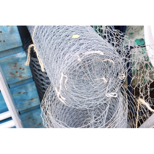 11 - Three. Small rolls of wire fencing