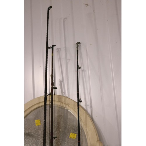 138 - Three sea fishing rods with reels