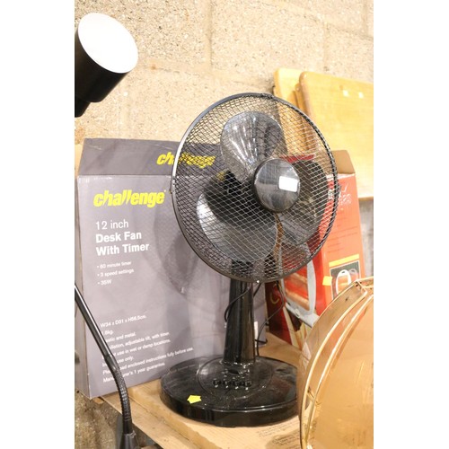 194 - Challenge 12 inch desk fan with timer and halogen heater-warranted until 12 noon Tuesday, following ... 