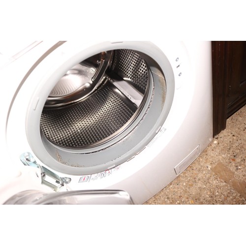 255 - John Lewis, J L,WM1407 washing machine - warranted until 12 noon, Tuesday, following the above sale