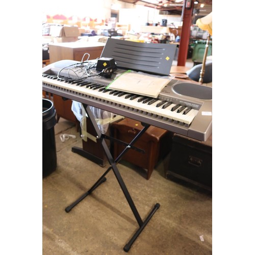 319 - Cassio organ & stand - warranted until 12 noon Tuesday following the above sale