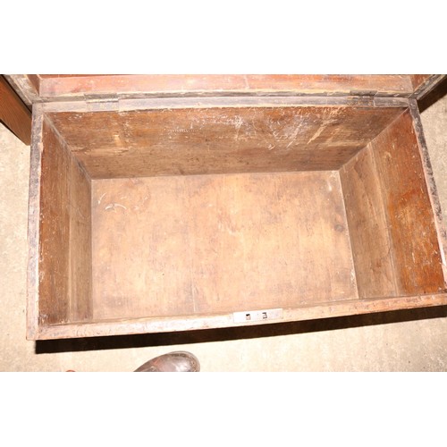 653 - Large wooden chest, brass lock