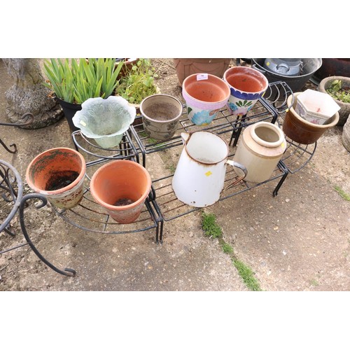 75 - Metal plant stand with various terracotta, glazed pots