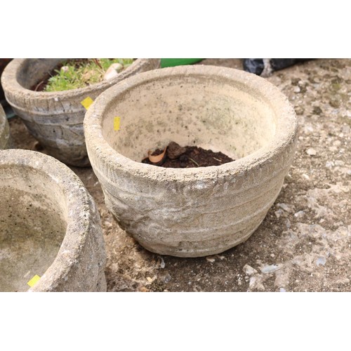 81 - Set of 4 small concrete planters