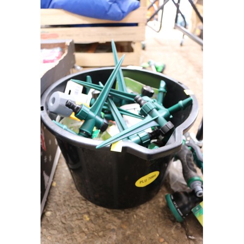 113 - Bucket containing quantity of spike water sprinklers and three extending watering wands