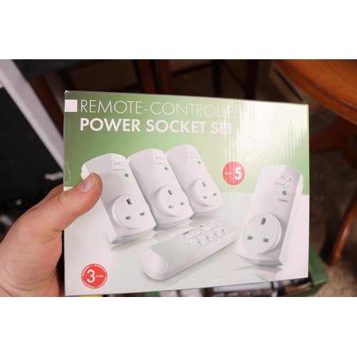 240 - Box containing various electric plug-in sockets including remote control power socket set, seven day... 