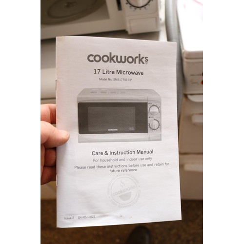 254 - Cookworks microwave - warranted until 12 noon Tuesday following the above sale