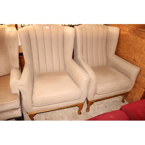 642 - Pair of modern beige wing back armchairs