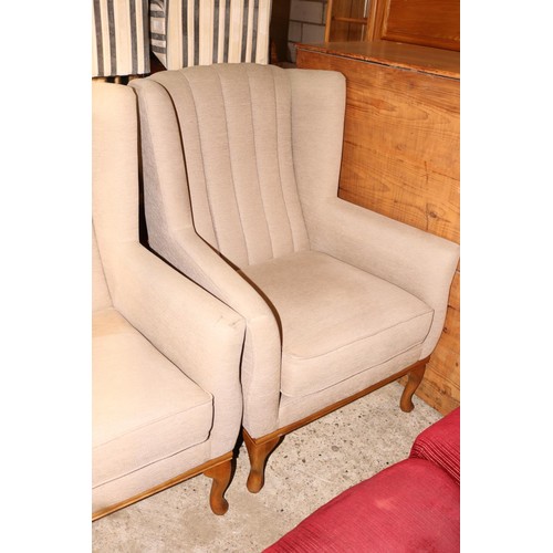 642 - Pair of modern beige wing back armchairs