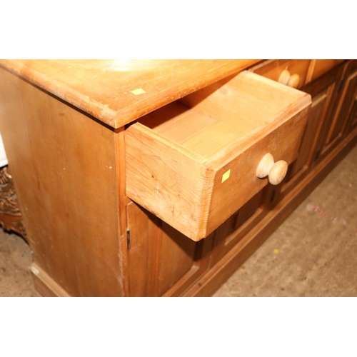 690 - Large pine sideboard with 5 short drawers & 3 cupboards