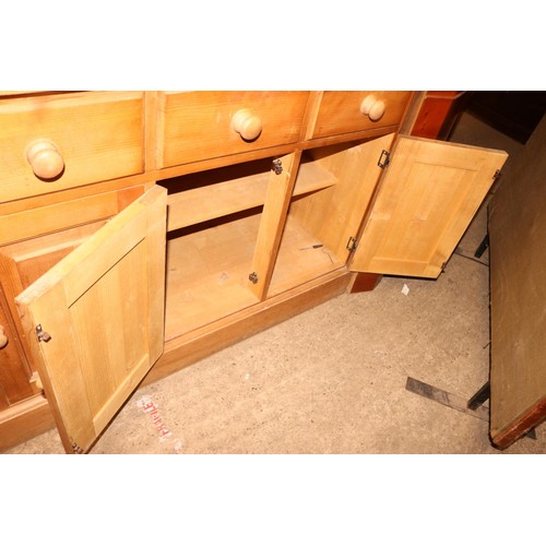 690 - Large pine sideboard with 5 short drawers & 3 cupboards