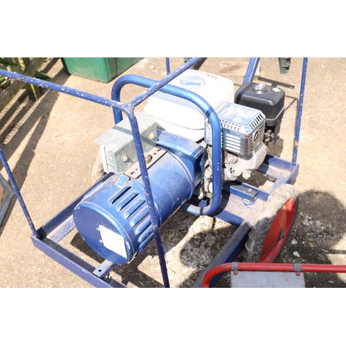 67 - 5.0hp Honda generator on wheels with metal cover (manual in office)