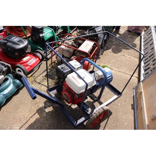 67 - 5.0hp Honda generator on wheels with metal cover (manual in office)