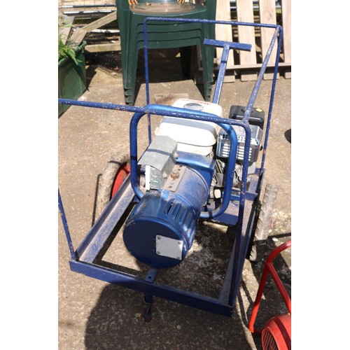 67 - 5.0hp Honda generator on wheels with metal cover (manual in office)