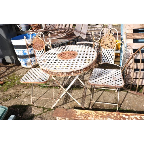 12 - Small lattice, patio table and two folding chairs