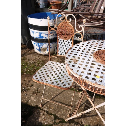 12 - Small lattice, patio table and two folding chairs