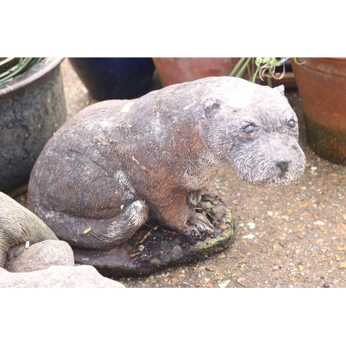 59 - Two garden otter ornaments