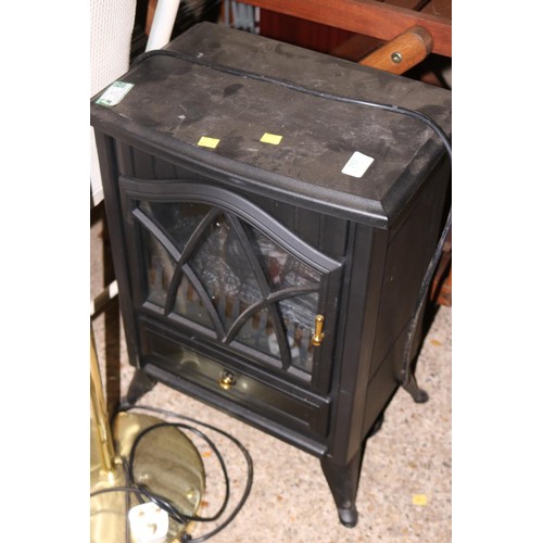 173 - Electric log effect heater - warranted until noon Tues following the above sale