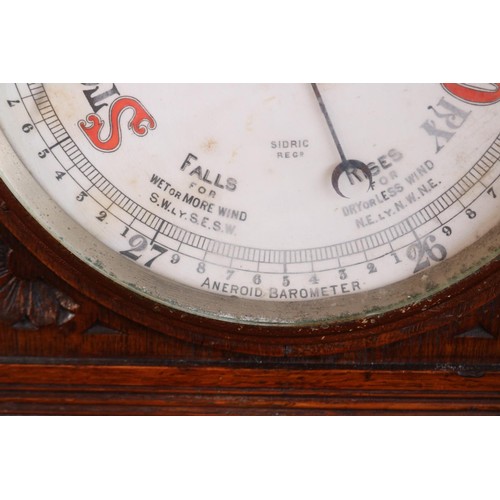601 - Ornate antique oak carved barometer & themometer