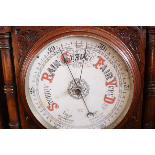 601 - Ornate antique oak carved barometer & themometer