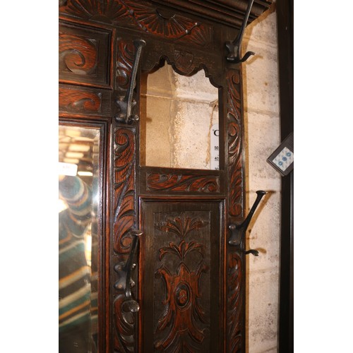 610 - Antique heavily carved oak hall stand