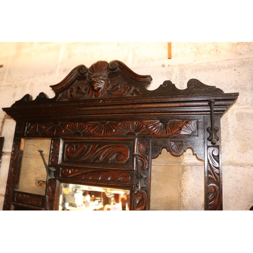 610 - Antique heavily carved oak hall stand