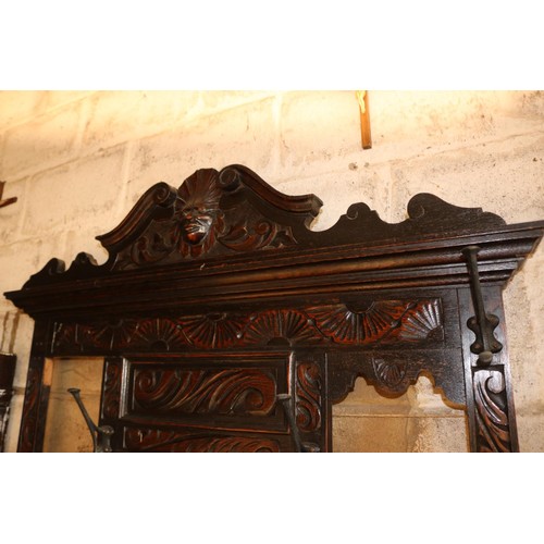 610 - Antique heavily carved oak hall stand