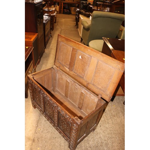 694 - Small oak carved 3 panel chest