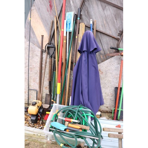 4 - Qty of garden tools, brolly, canes, brooms & hose