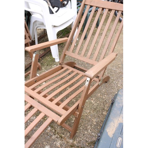 11 - Two steamer wooden lounge chairs with various cushions